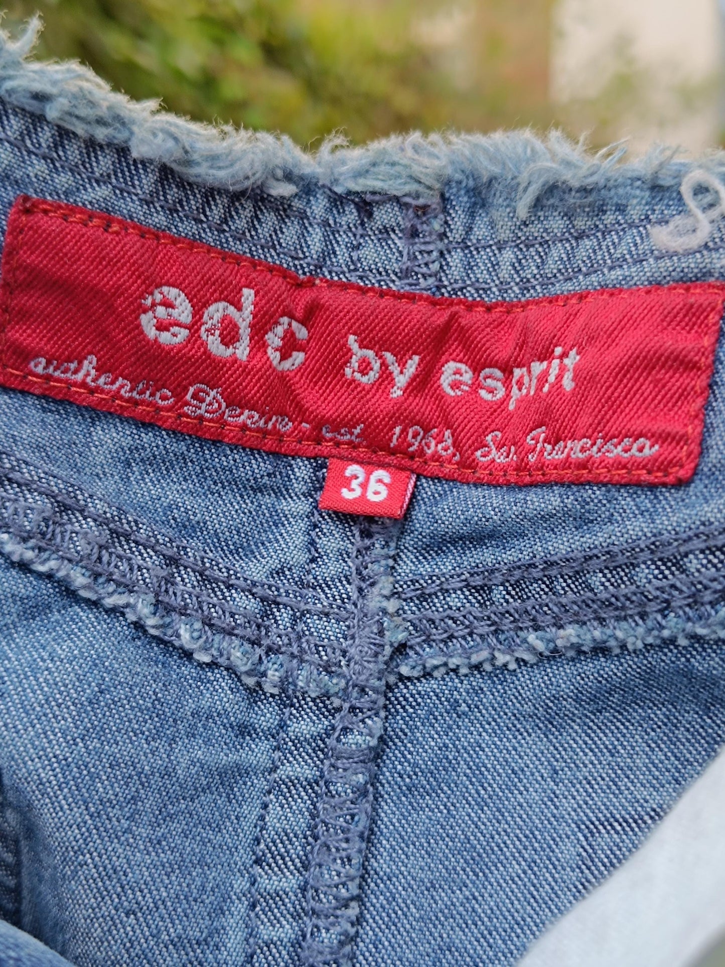 A photo of the red brand tag on an Esprit Maxi Skirt. The tag reads edc by esprit and highlights that the skirt is a DE38 in size