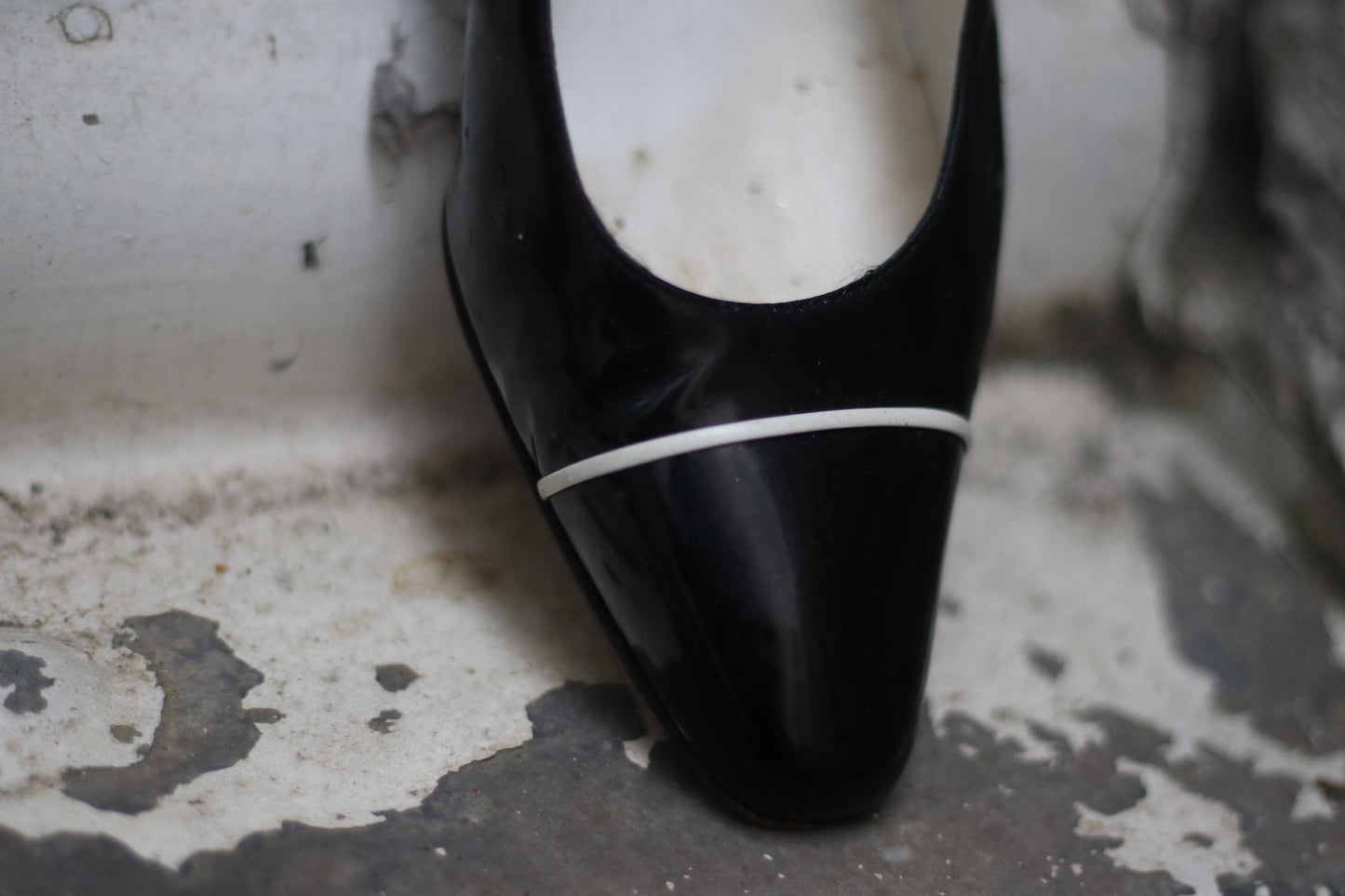 Detail shot of 80s Retro designer pumps by Bruno Magli photographed against a minimalist white background.