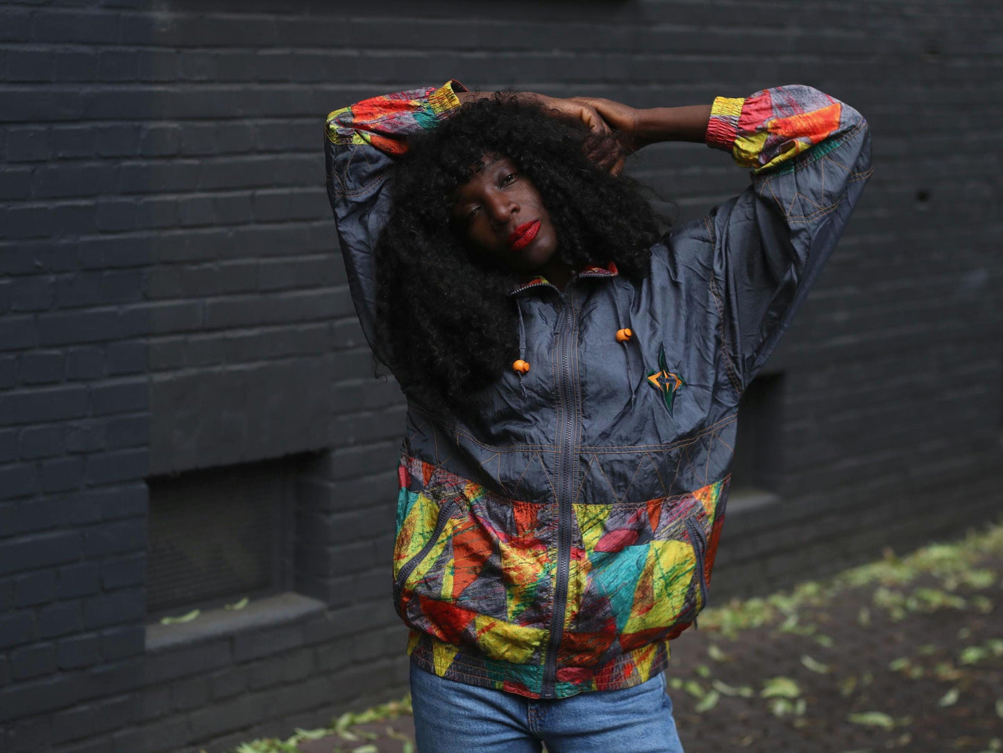 Bold color block jacket styled casually with jeans