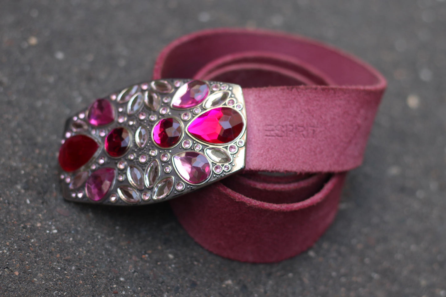 Vintage Y2K pink suede Esprit belt with ornate gemstone buckle on dark background