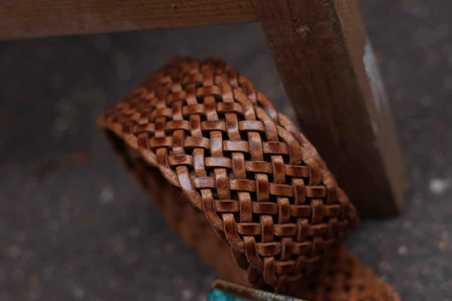Close-up of the braided texture of a brown vintage 70s boho leather belt