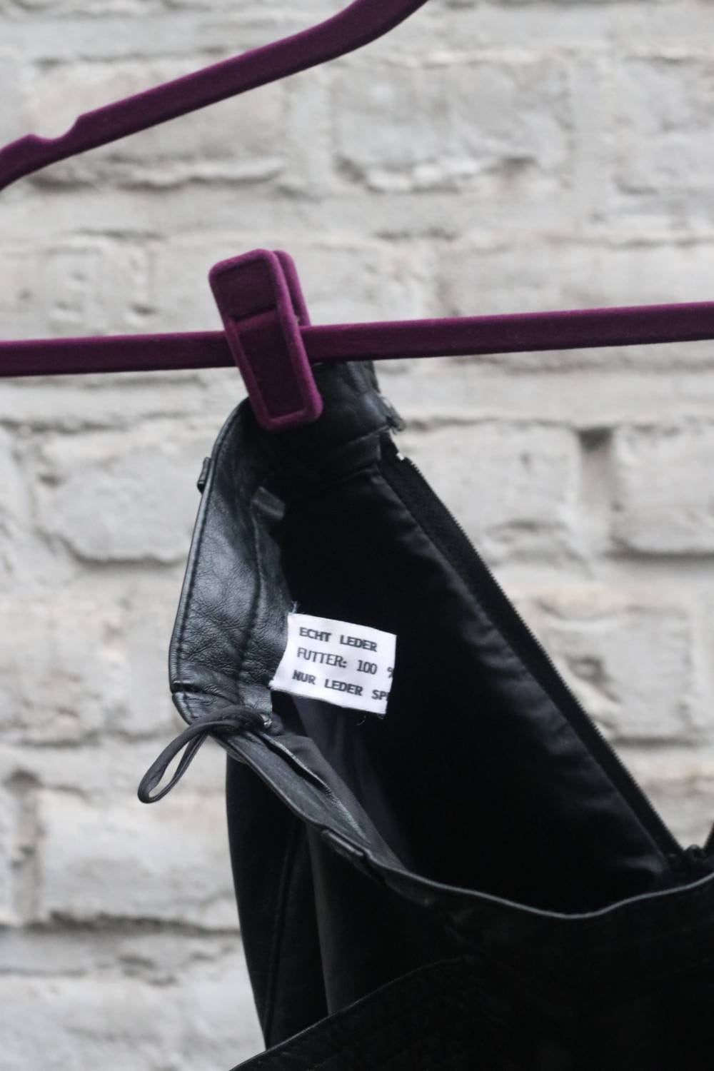 90s Leather Skirt in Black. Vintage Minimalist Design with Statement pockets. Monochrome classic sleek style. mini silhouette