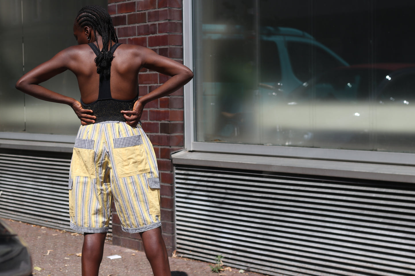 Yellow striped high-waisted shorts with patch pockets