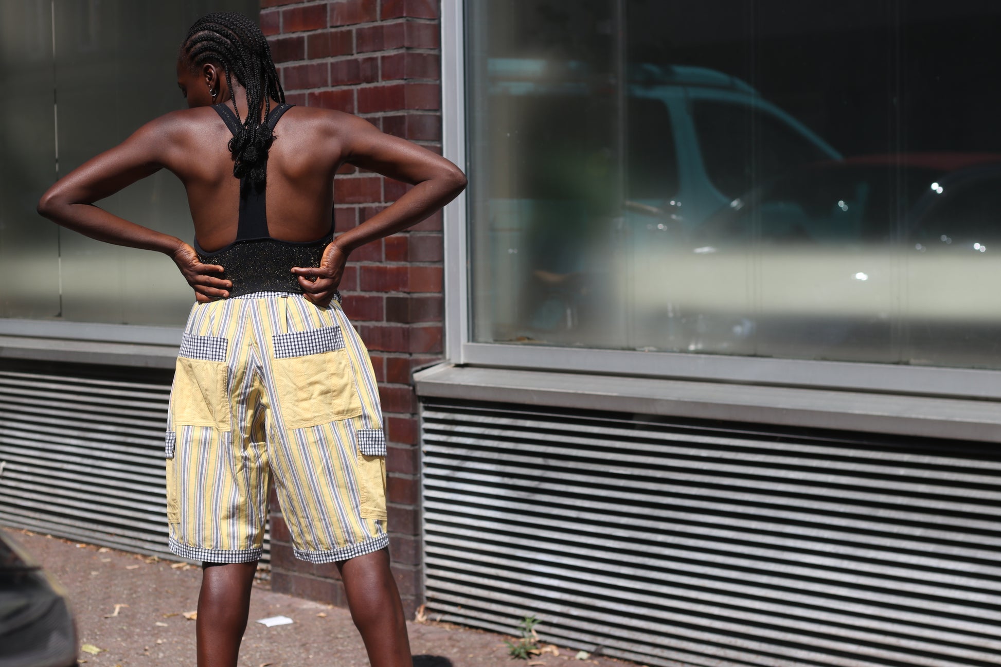 Yellow striped high-waisted shorts with patch pockets