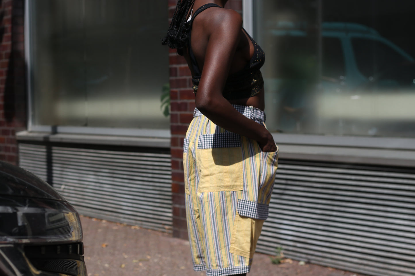 Yellow striped high-waisted shorts with patch pockets