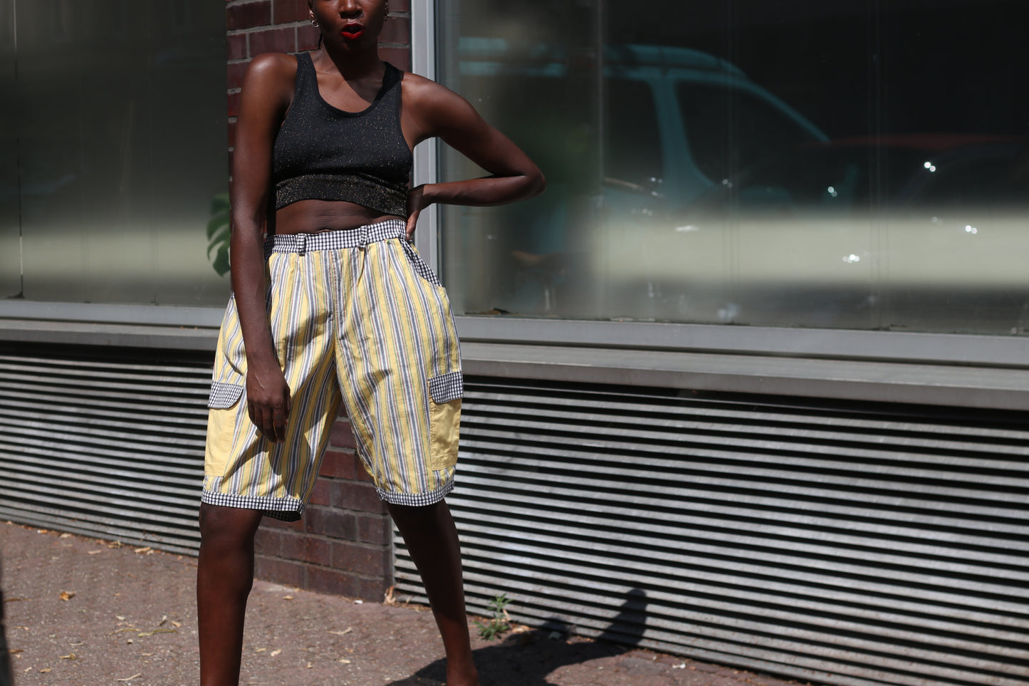 Yellow striped high-waisted shorts with patch pockets