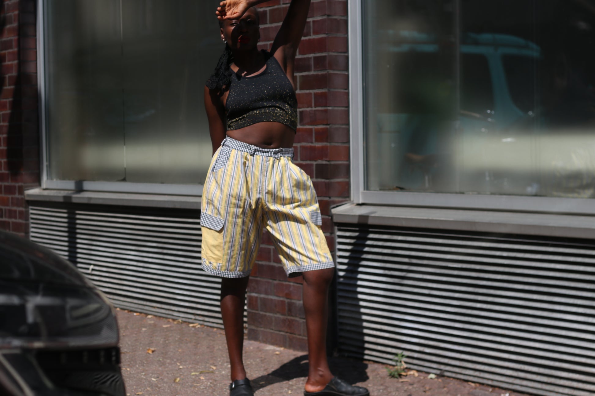 Yellow striped high-waisted shorts with patch pockets