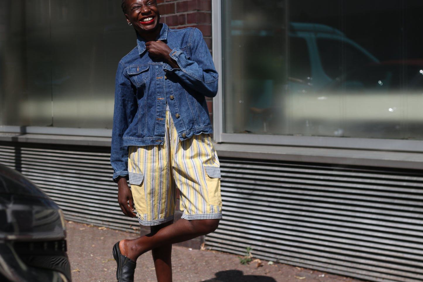Yellow striped high-waisted shorts with patch pockets
