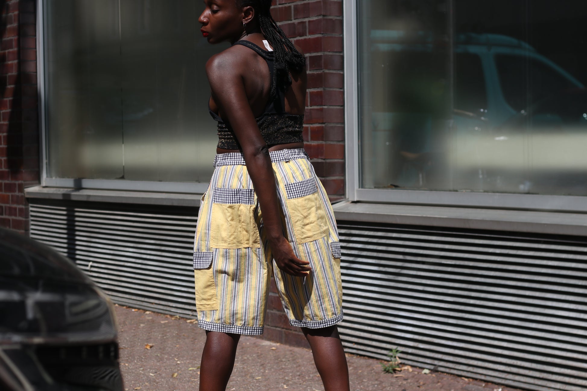Yellow striped high-waisted shorts with patch pockets