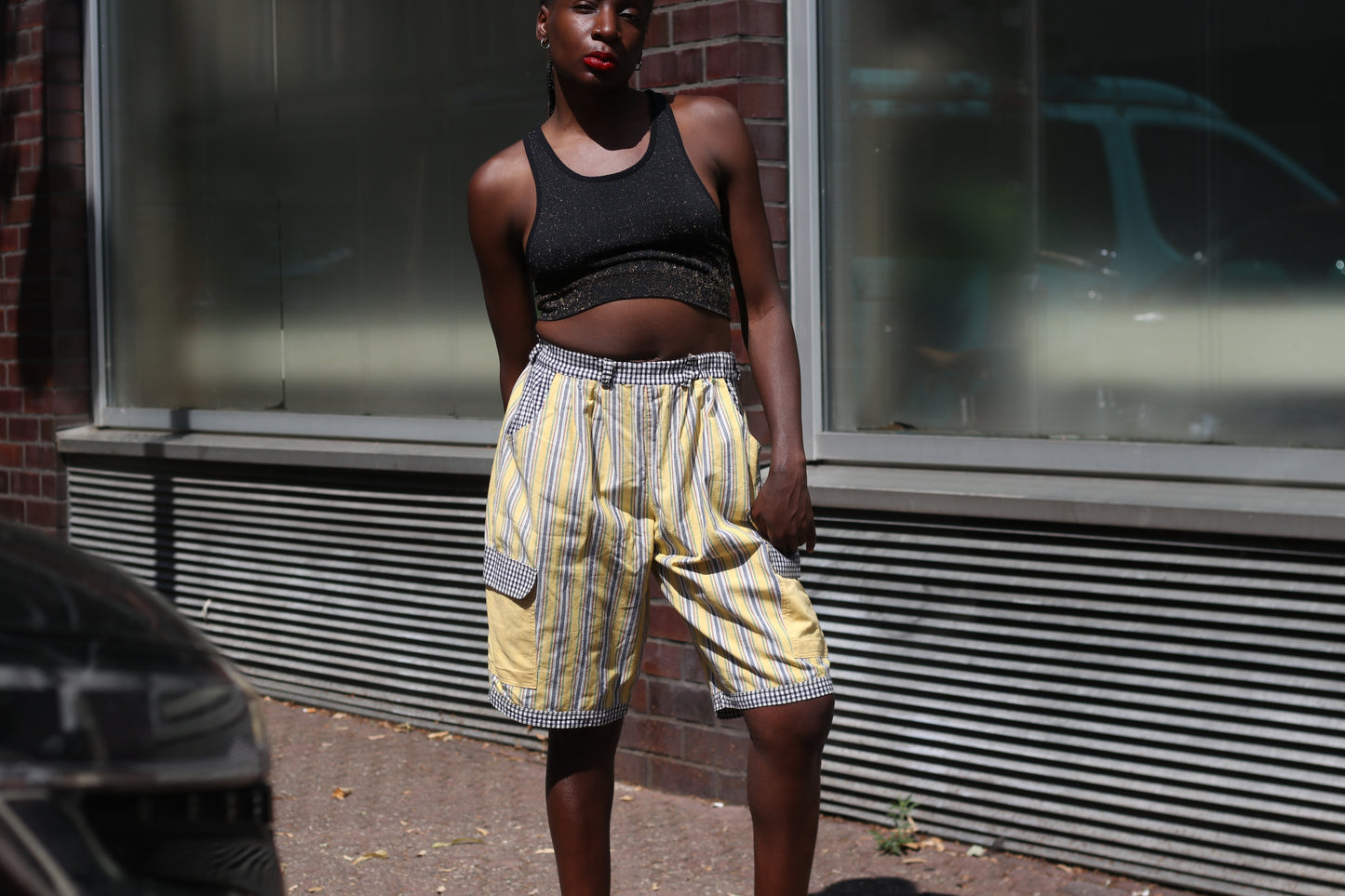 Yellow striped high-waisted shorts with patch pockets