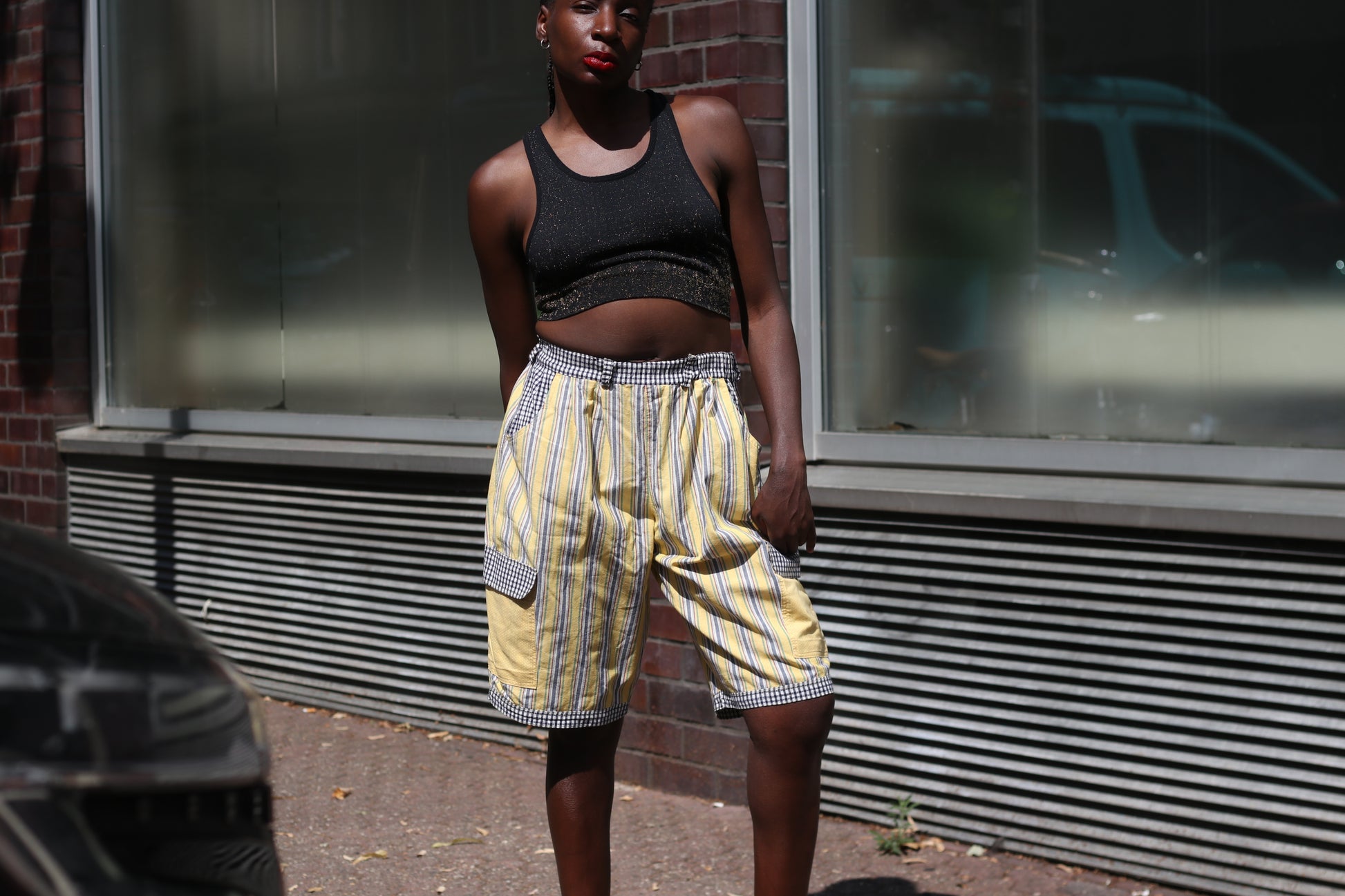 Yellow striped high-waisted shorts with patch pockets