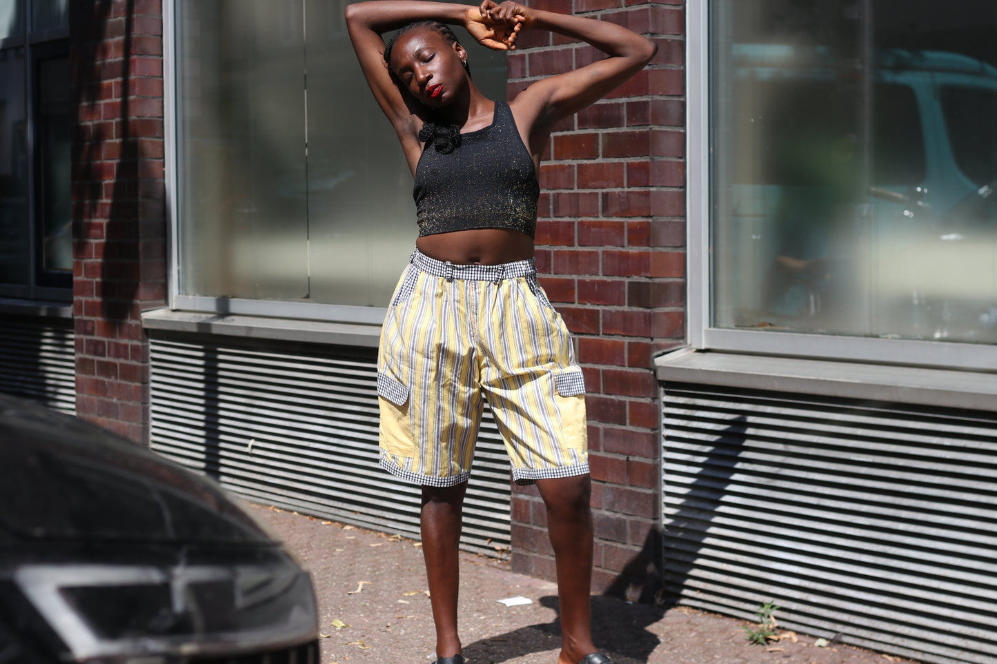 Yellow striped high-waisted shorts with patch pockets