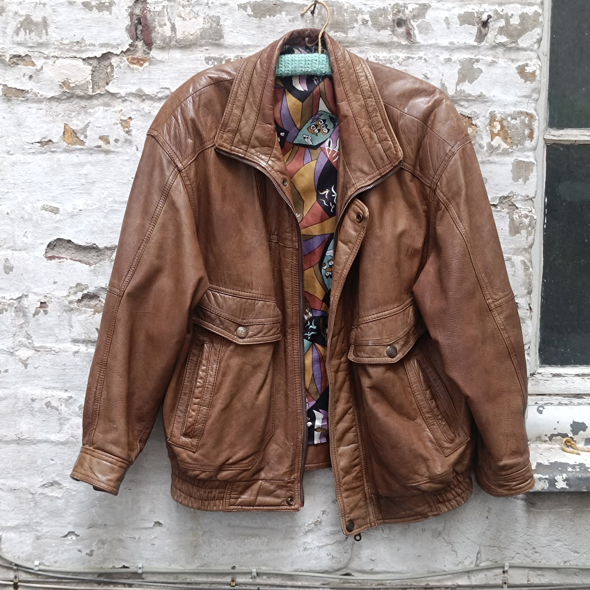 Vintage 1980s Brown Leather Bomber Jacket abstract patterned lining oversized M