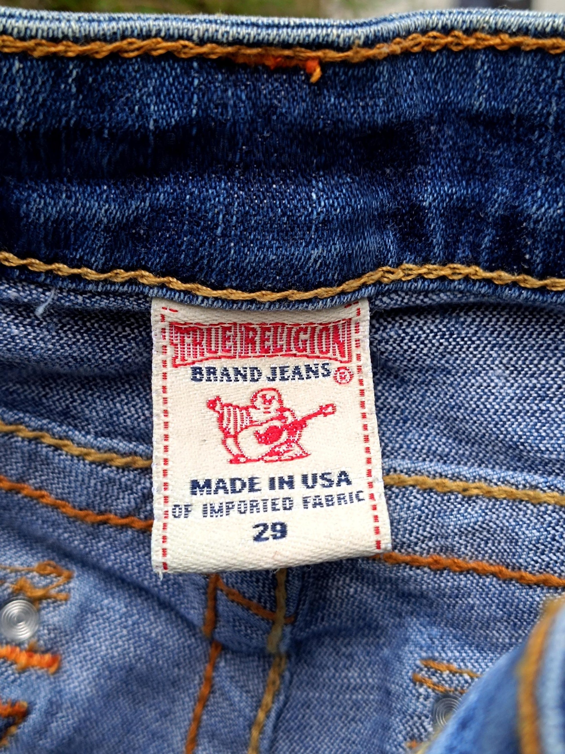 Close up of the size tag of a Blue &quot;True Religion&#39; light blue women&#39;s denim