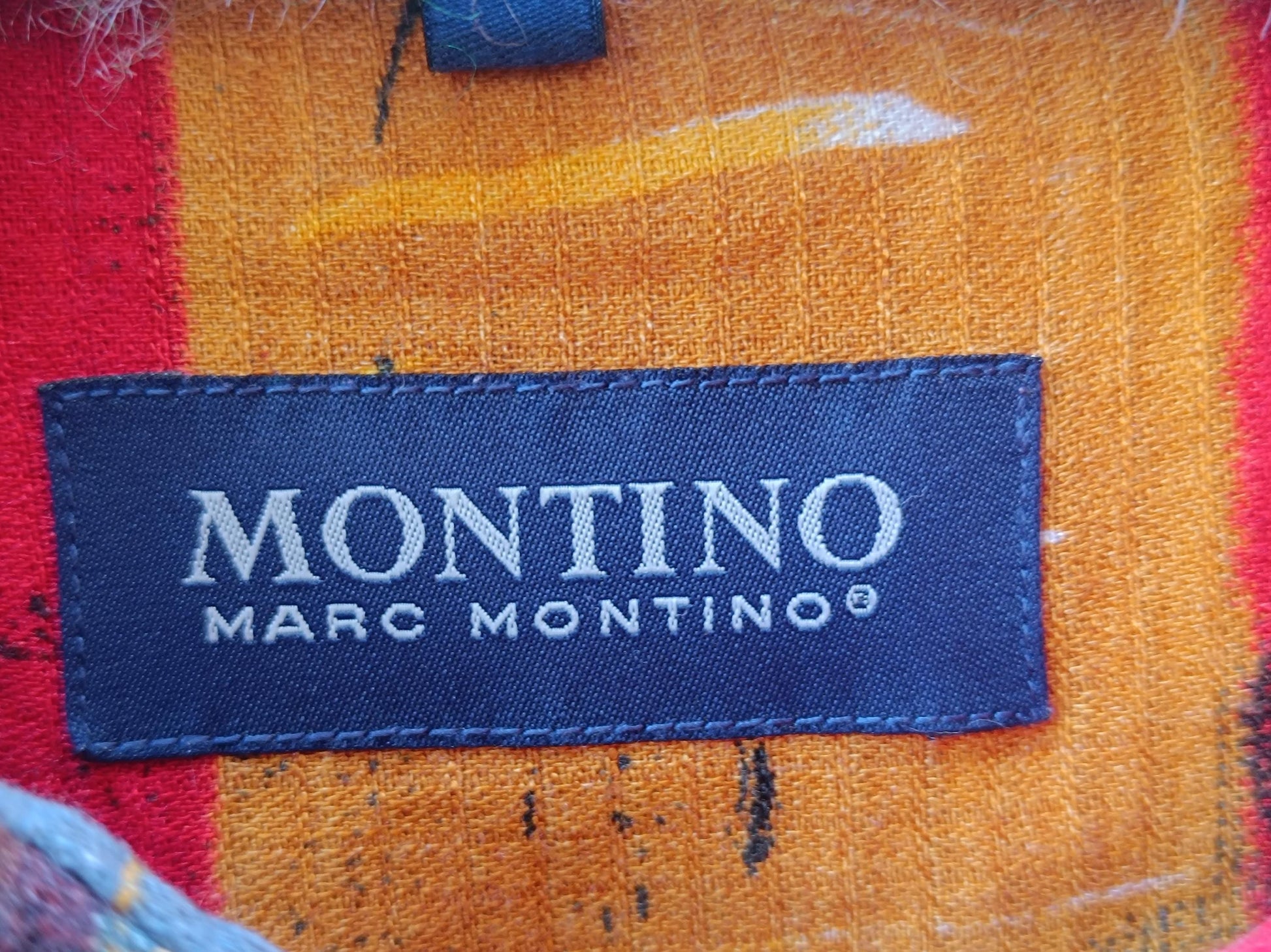 Close-up of a fabric label reading &#39;MONTINO MARC MONTINO®&#39;.&quot;