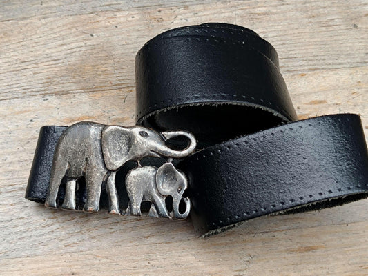 Vintage elephant Buckle black Leather Belt photographed on a brown rustic wooden surface. The Handmade Boho Chic Accessory is perfect for festival style