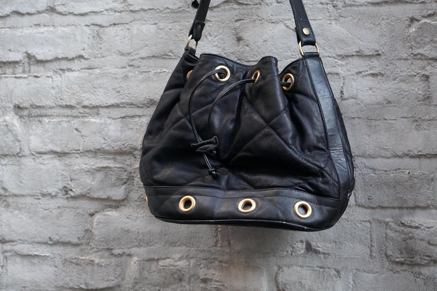 Vintage Quilted Black Leather Bucket Bag Made in Italy Gold Grommet Drawstring