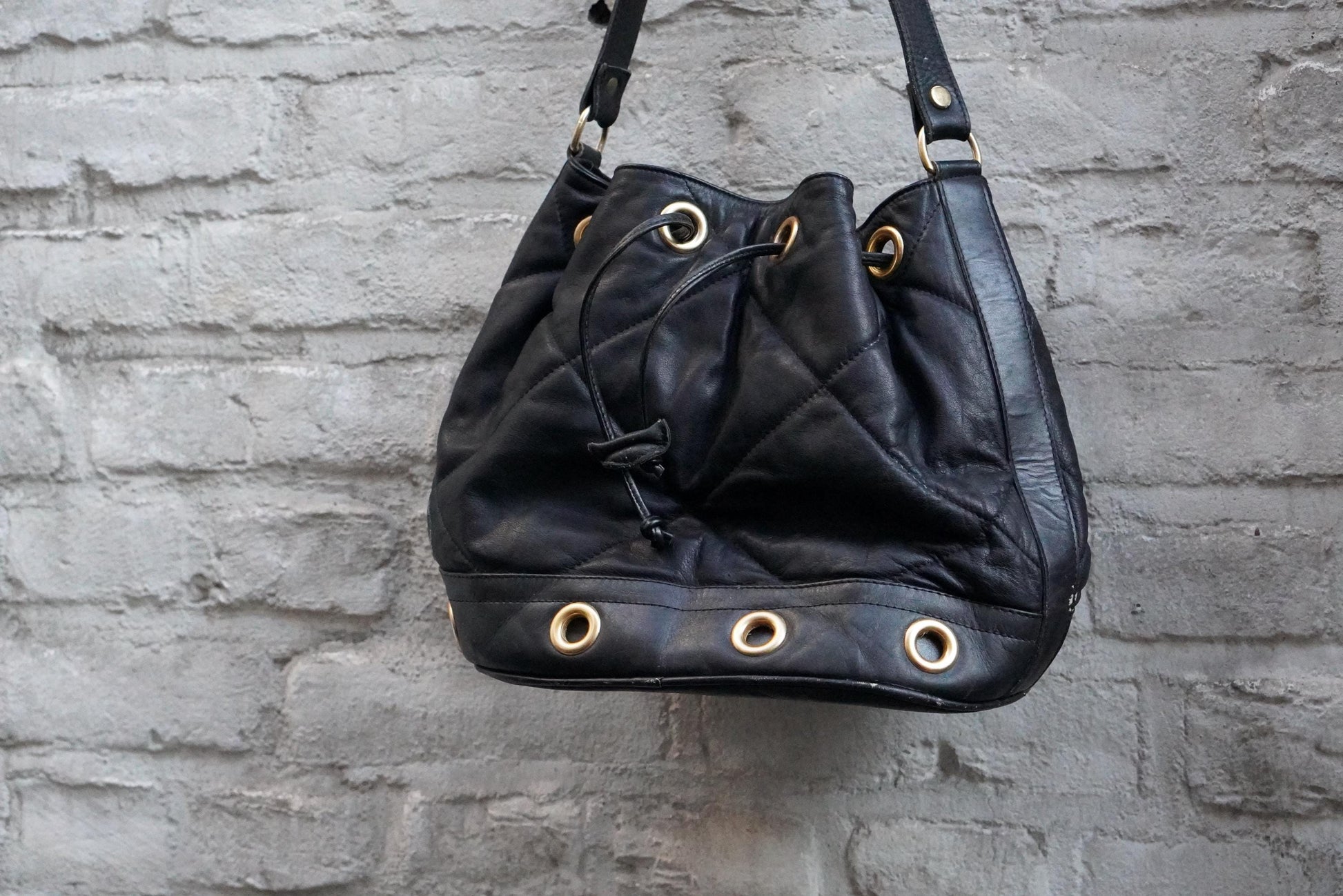 Vintage Quilted Black Leather Bucket Bag Made in Italy Gold Grommet Drawstring
