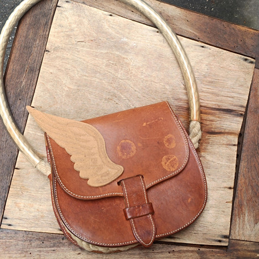 Vintage Sculptural Tan Leather Saddle Bag Rope Detail Wooden Wing Appliqué Boho