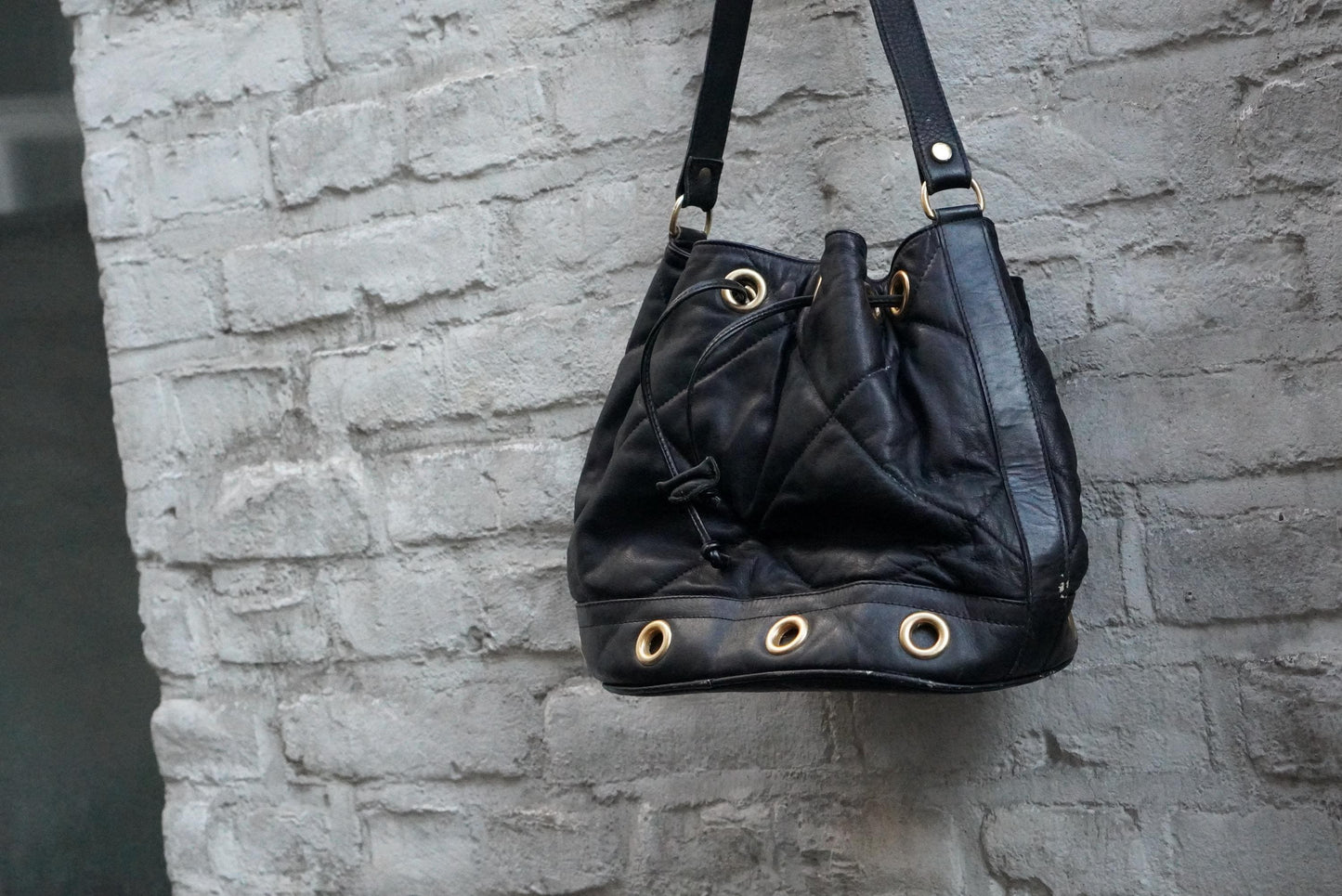 Vintage Quilted Black Leather Bucket Bag Made in Italy Gold Grommet Drawstring