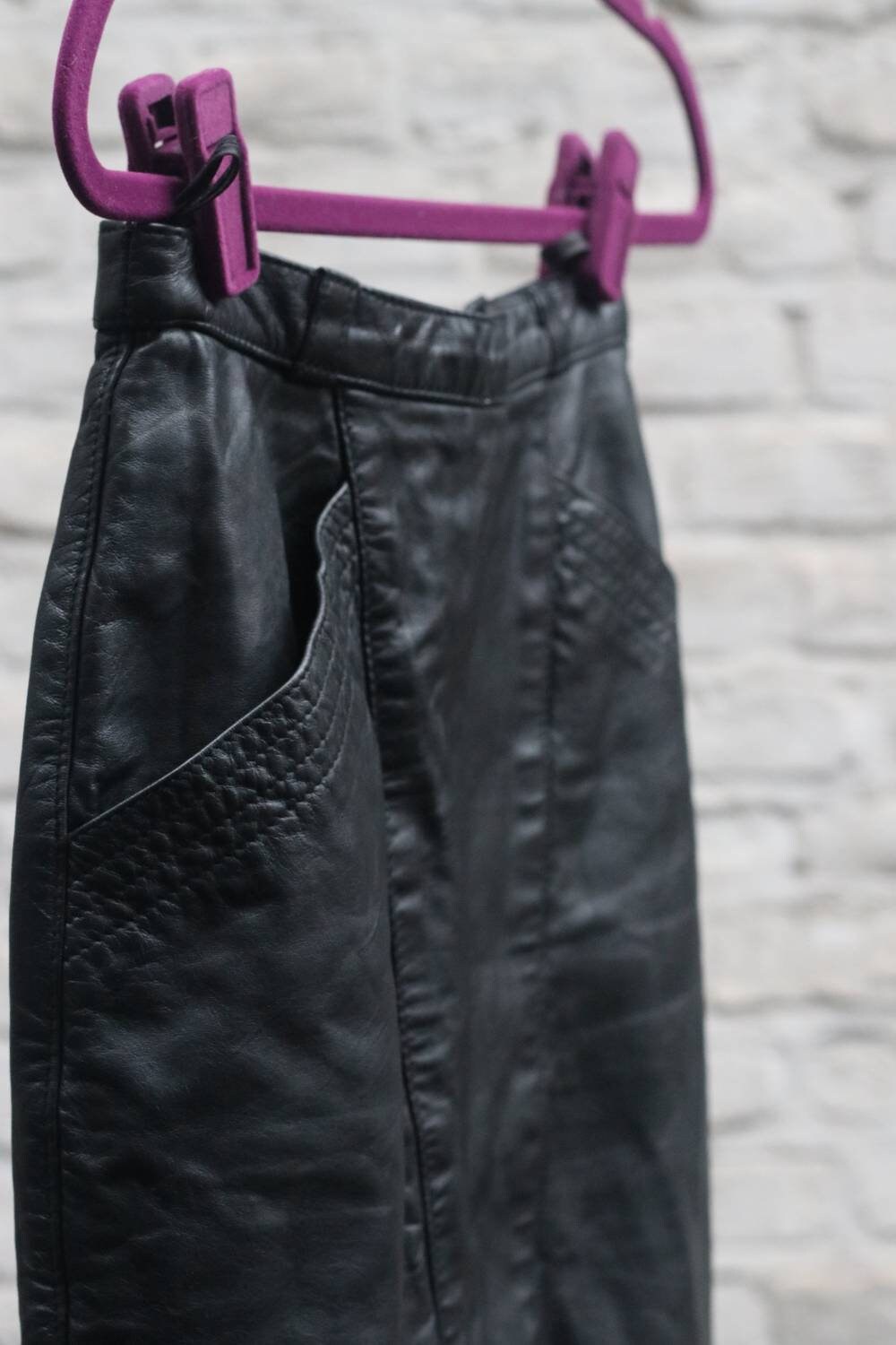 90s Leather Skirt in Black. Vintage Minimalist Design with Statement pockets. Monochrome classic sleek style. mini silhouette